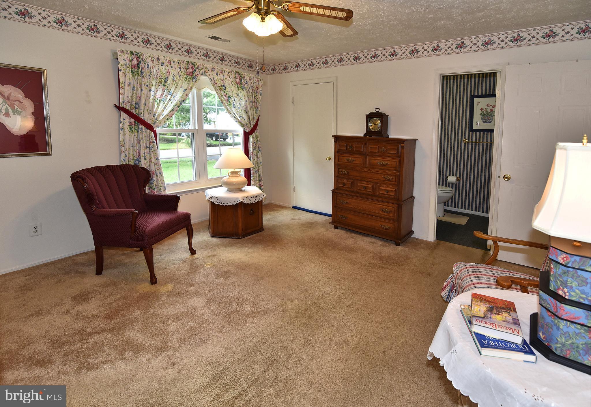 8219 Grainfield Road Severn, MD 21144 - Photo 19 of 30 a bedroom with furniture and a window