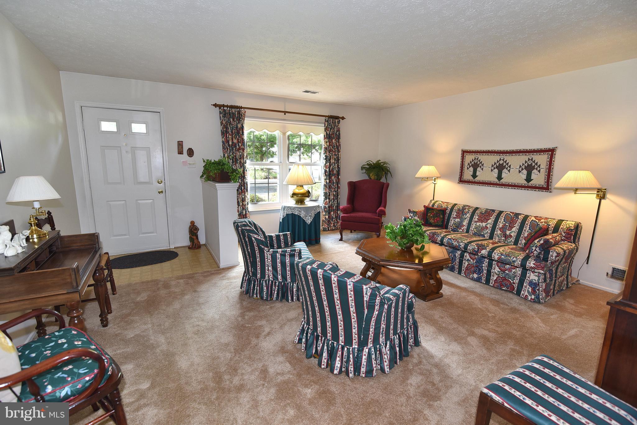 8219 Grainfield Road Severn, MD 21144 - Photo 3 of 30 a living room with furniture and a window