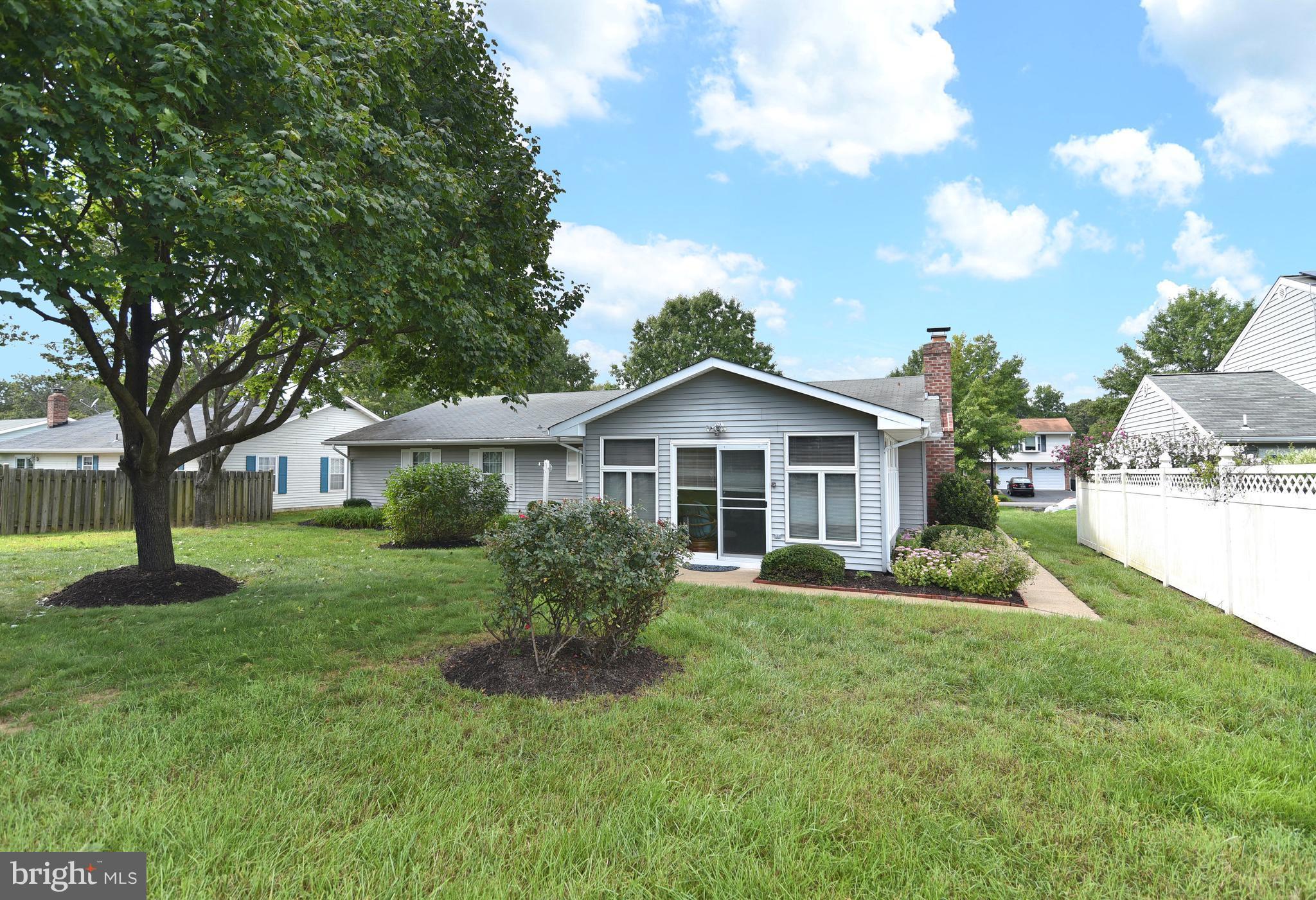 8219 Grainfield Road Severn, MD 21144 - Photo 26 of 30 a front view of a house with a yard