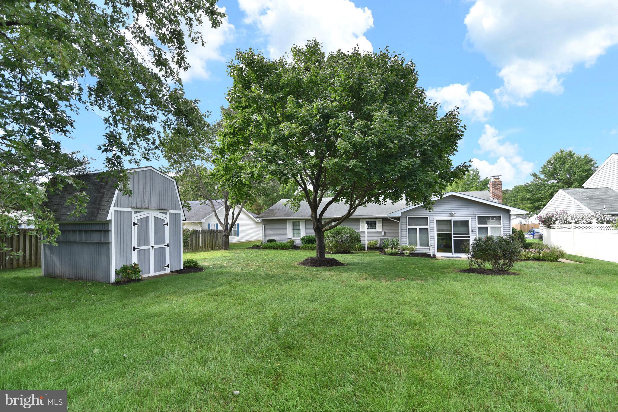 8219 Grainfield Road Severn, MD 21144 - Photo 27 of 30 a view of a house with a yard