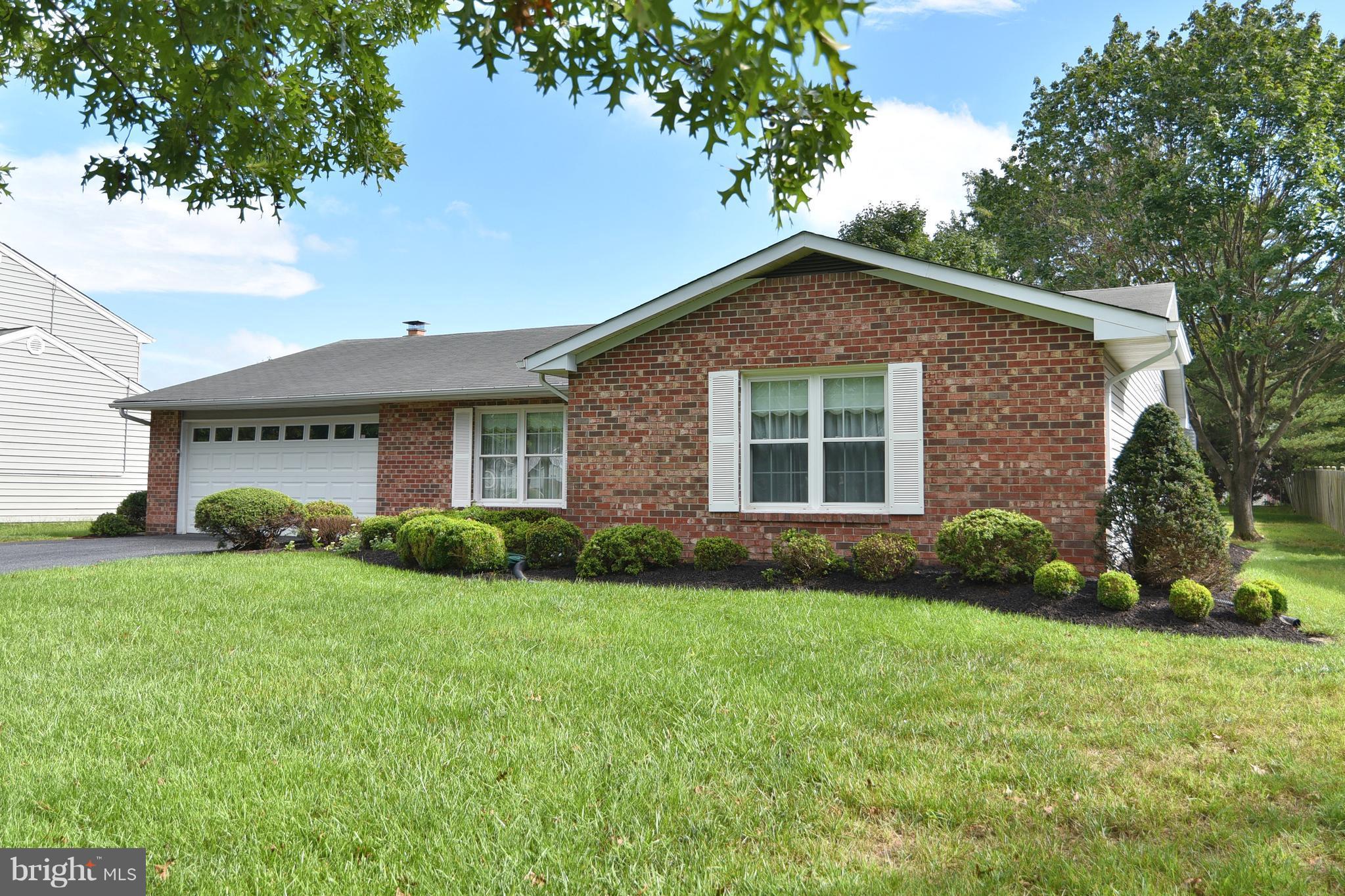8219 Grainfield Road Severn, MD 21144 - Photo 29 of 30 a front view of a house with a yard and garage