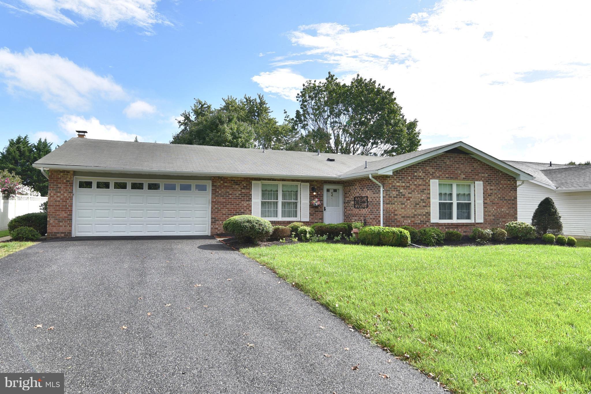 8219 Grainfield Road Severn, MD 21144 - Photo 30 of 30 a view of a house with a yard and garage