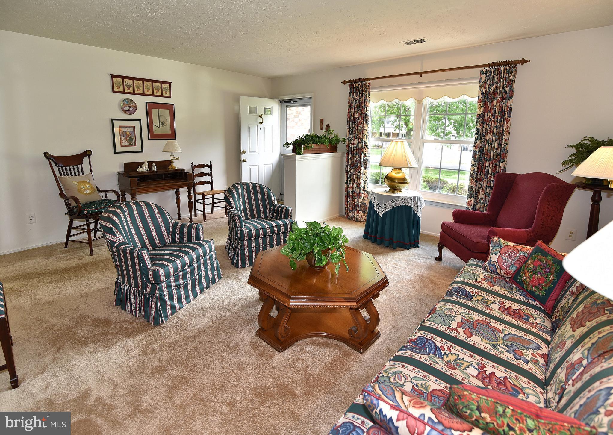 8219 Grainfield Road Severn, MD 21144 - Photo 4 of 30 a living room with furniture and a large window