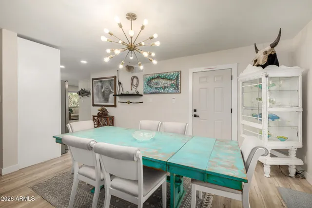 a view of a dining room with furniture window and wooden floor