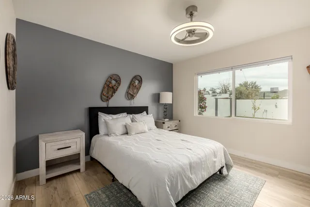 a bedroom with a bed and a window