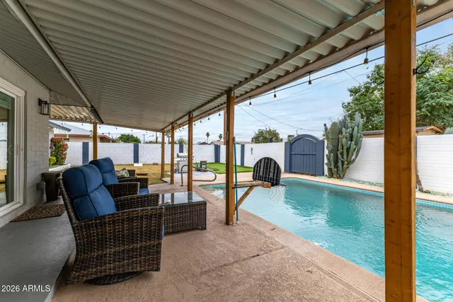 a outdoor living space with patio furniture and a potted plant