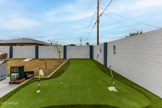 a view of a swimming pool with a chair
