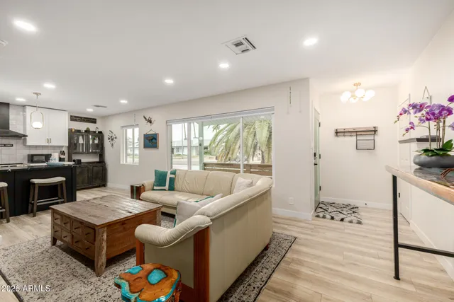 a living room with furniture and a rug