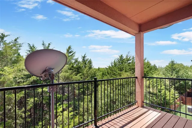 a view of a balcony with a potted plant