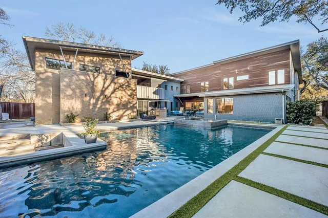 a view of a house with pool side view