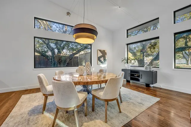 a view of a dining room with furniture window and wooden floor