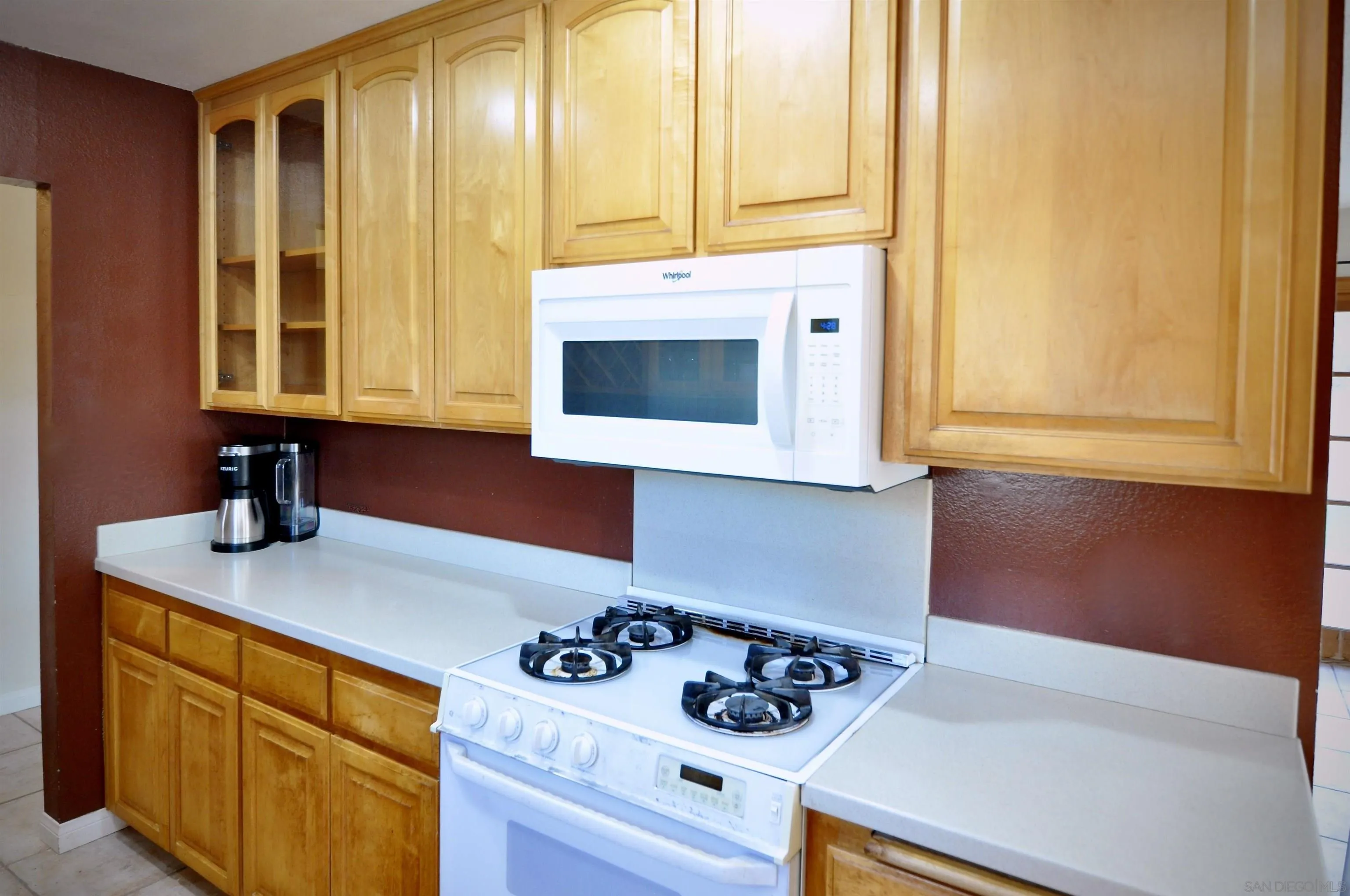 12549 Taunt Place Poway, CA 92064 - Photo 11 of 38 a kitchen with a cabinets and window