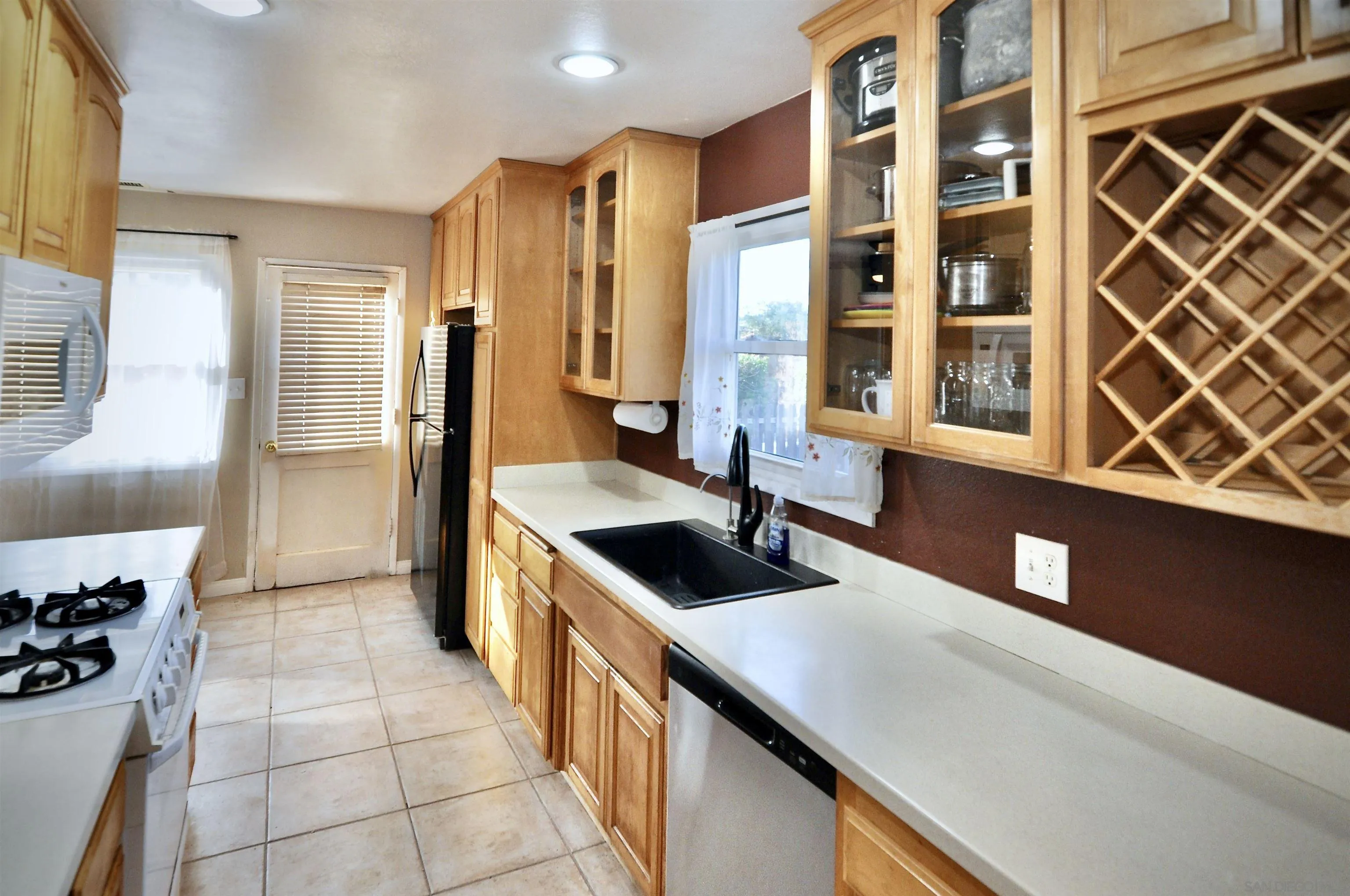 12549 Taunt Place Poway, CA 92064 - Photo 12 of 38 a kitchen with a cabinets and counter space