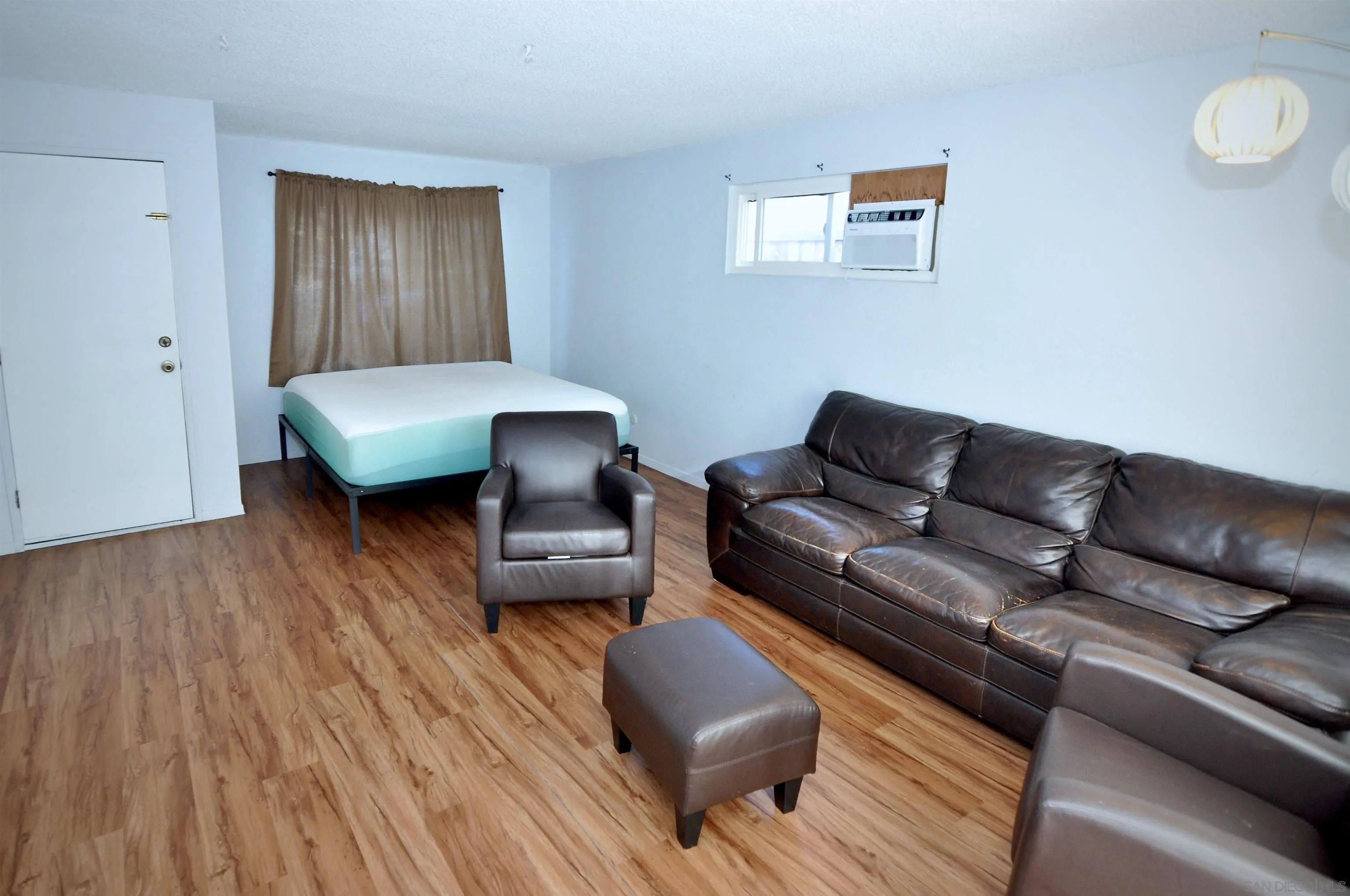 12549 Taunt Place Poway, CA 92064 - Photo 13 of 38 a living room with furniture and a wooden floor