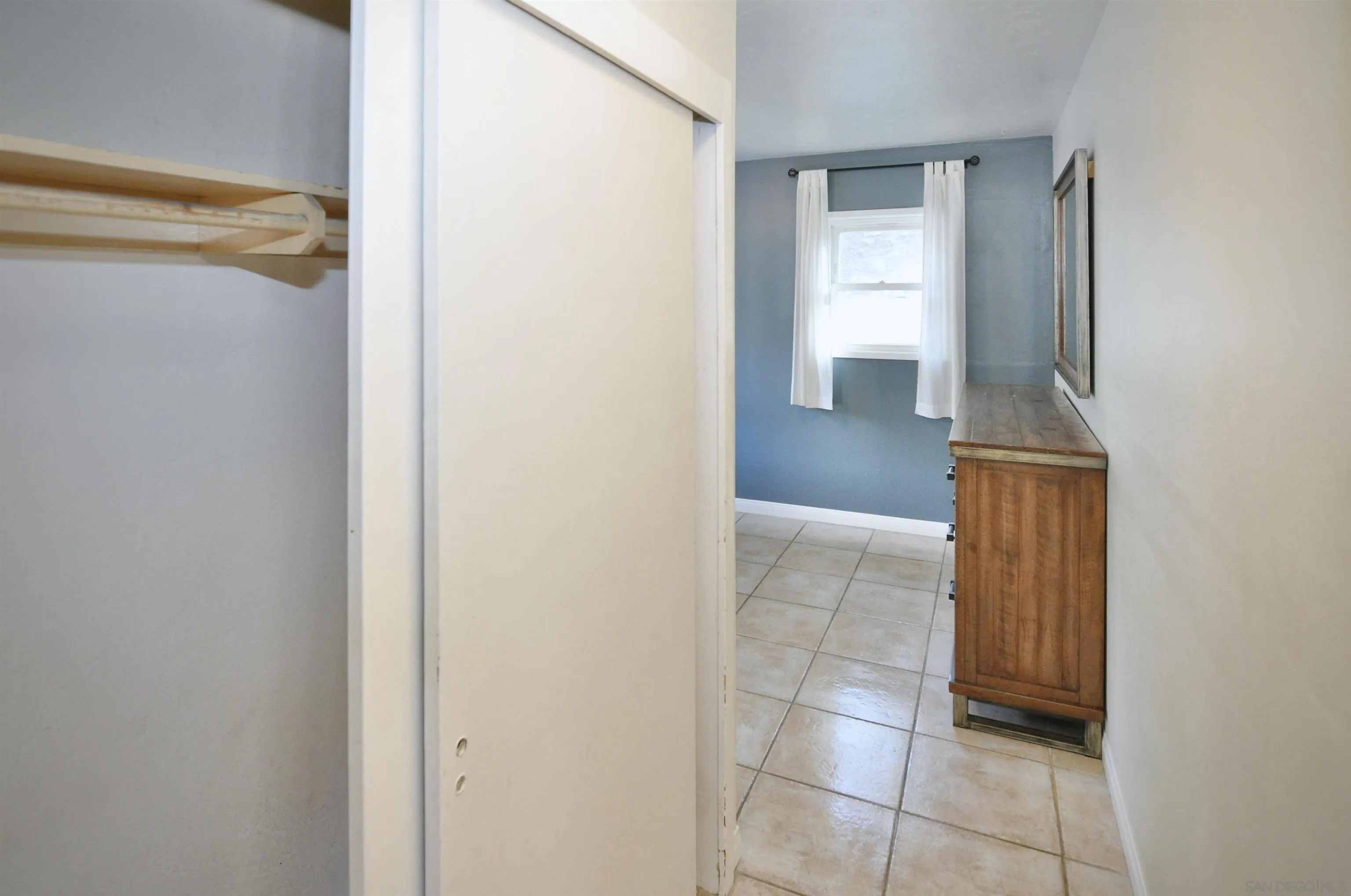 12549 Taunt Place Poway, CA 92064 - Photo 15 of 38 a view of a bathroom from a corridor