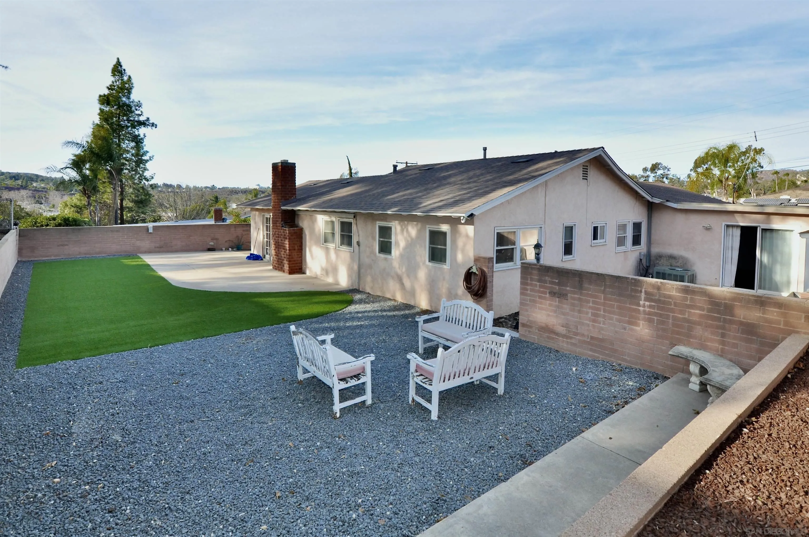 12549 Taunt Place Poway, CA 92064 - Photo 24 of 38 a view of a house with a yard patio and fire pit