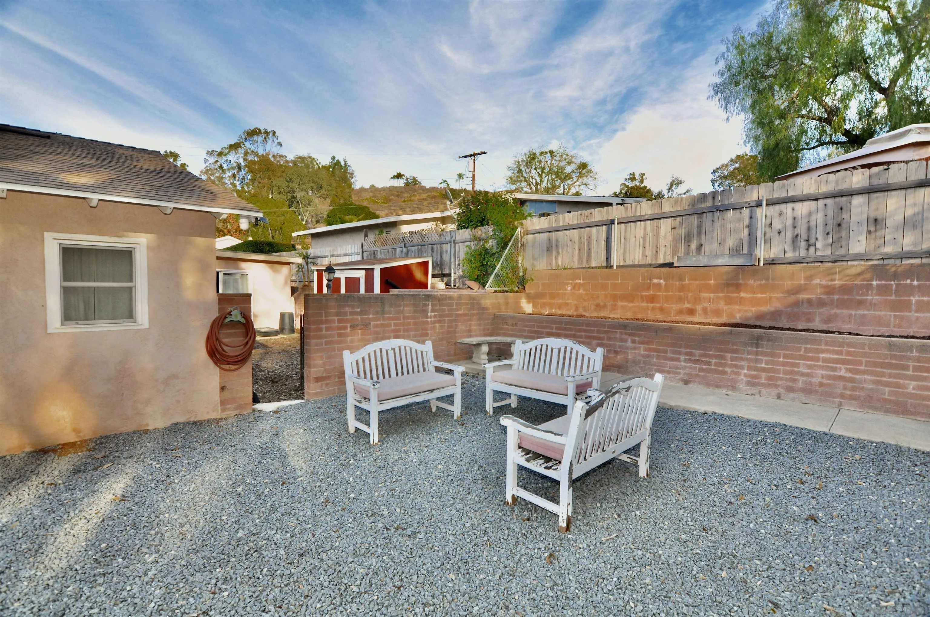 12549 Taunt Place Poway, CA 92064 - Photo 28 of 38 a backyard of a house with table and chairs