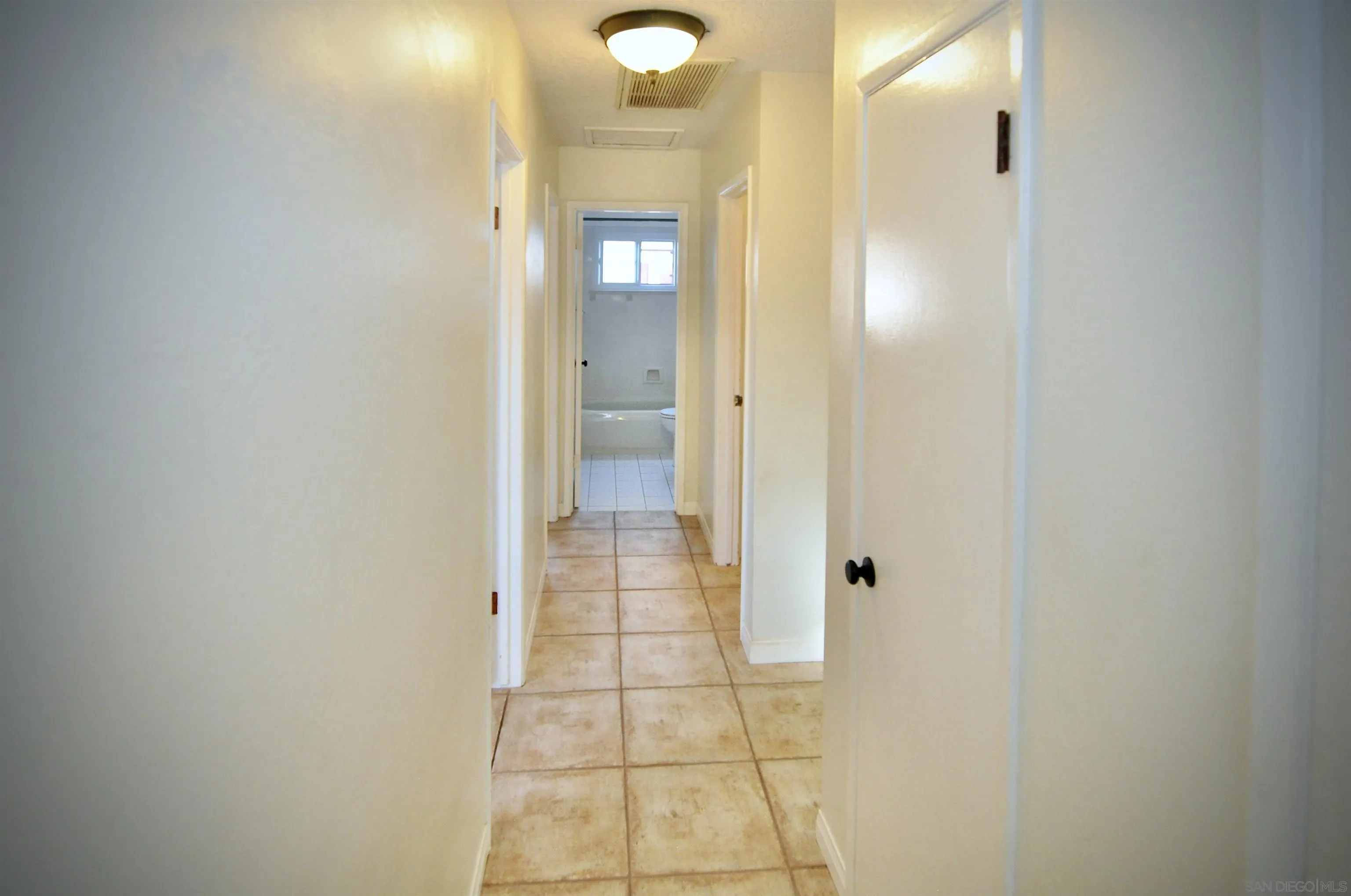 12549 Taunt Place Poway, CA 92064 - Photo 31 of 38 a view of a bathroom with mirror