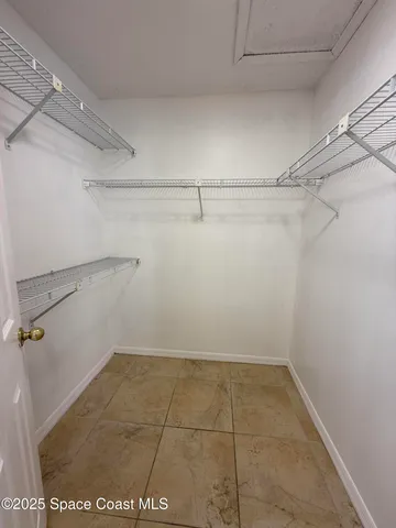 a view of a room with racks on the wall