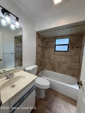 a bathroom with a sink a toilet and a bathtub