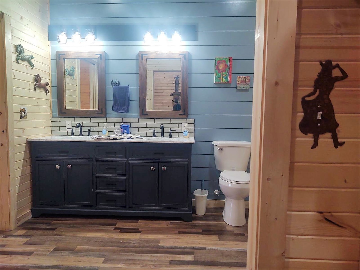377 Lusk Road Golconda, IL 62938 - Photo 14 of 42 a bathroom with a toilet a sink and mirror
