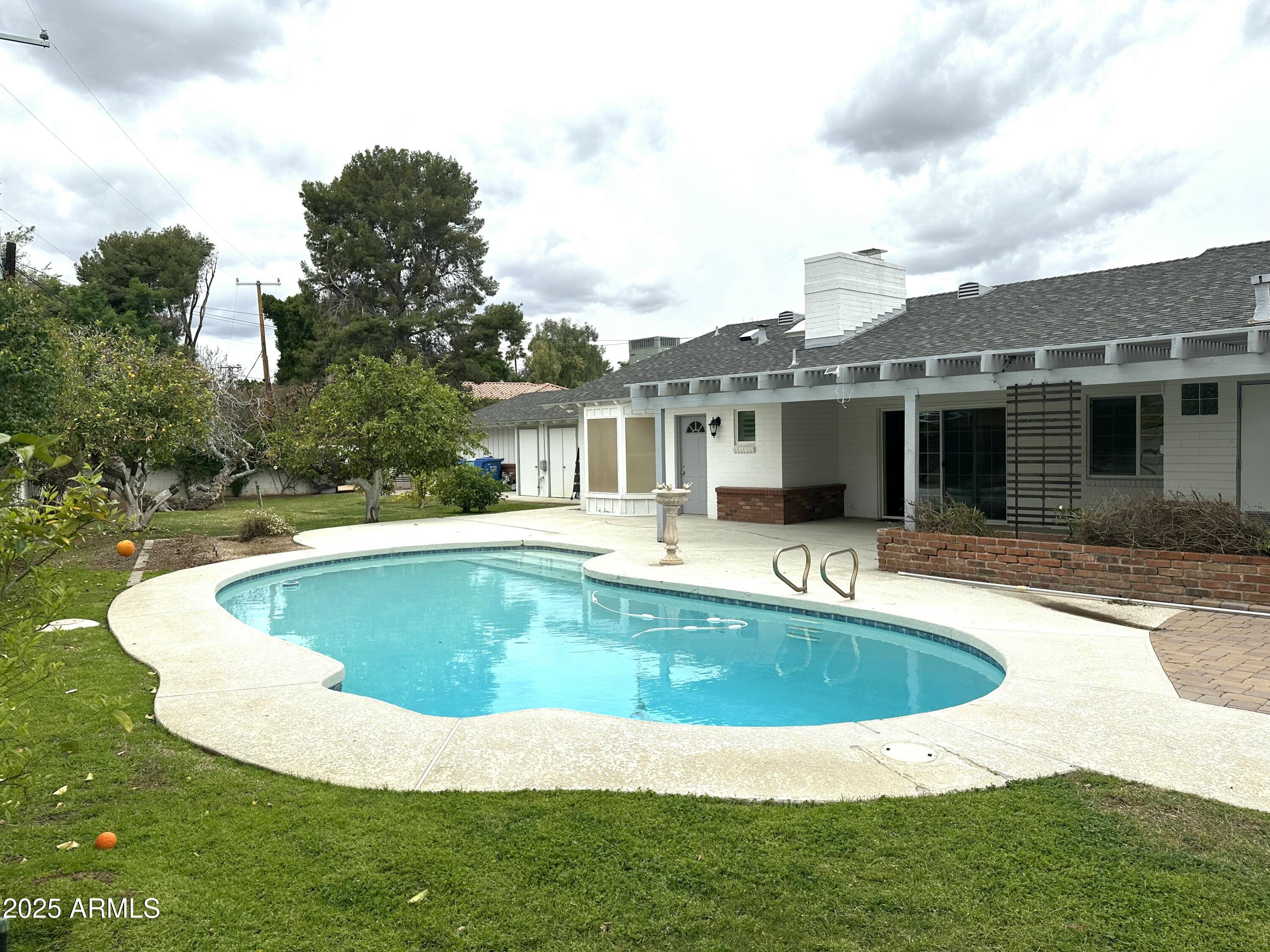 511 West Ocotillo Road Phoenix, AZ 85013 - Photo 2 of 14 a view of outdoor space yard swimming pool and porch