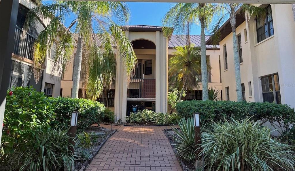 23465 Harbor View Road, Unit 1006 Punta Gorda, FL 33980 - Photo 2 of 41 a view of a building with a garden