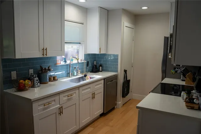 a dining room with furniture and a chandelier