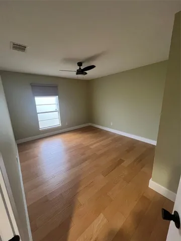 a view of empty room with windows