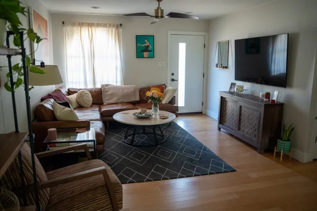 a view of a dining room with furniture window and wooden floor