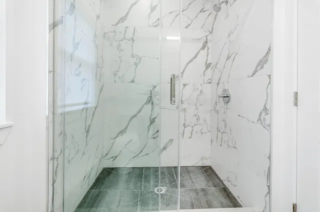 a bathroom with a sink toilet and a mirror