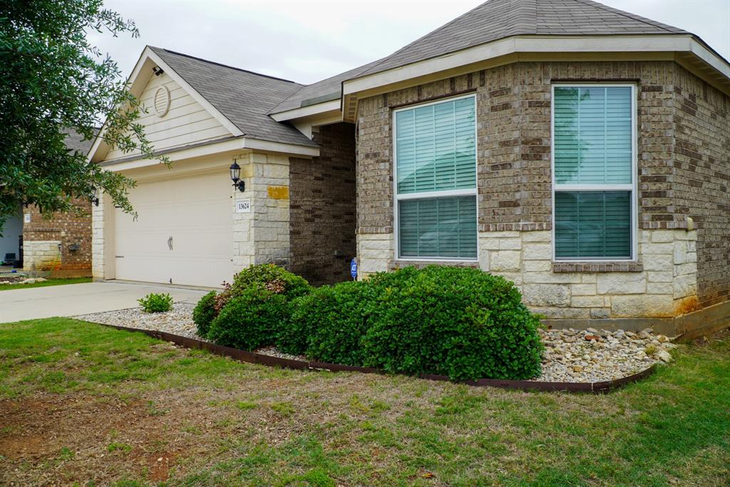 13624 Helix Bridge Way Crowley, TX 76036 - Photo 3 of 25 a front view of a house with garden
