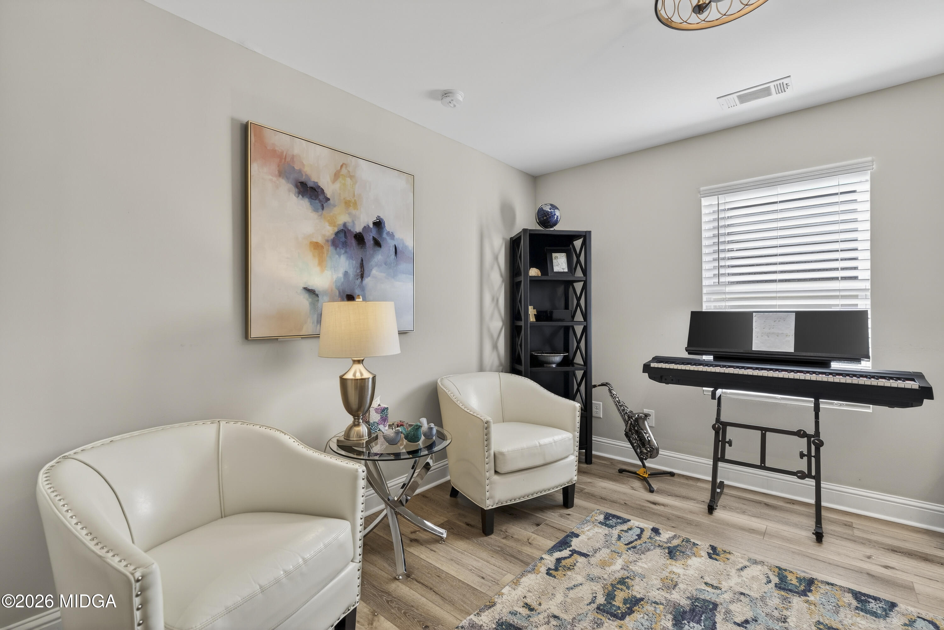737 Springhill Drive Gray, GA 31032 - Photo 14 of 60 a living room with furniture and a window