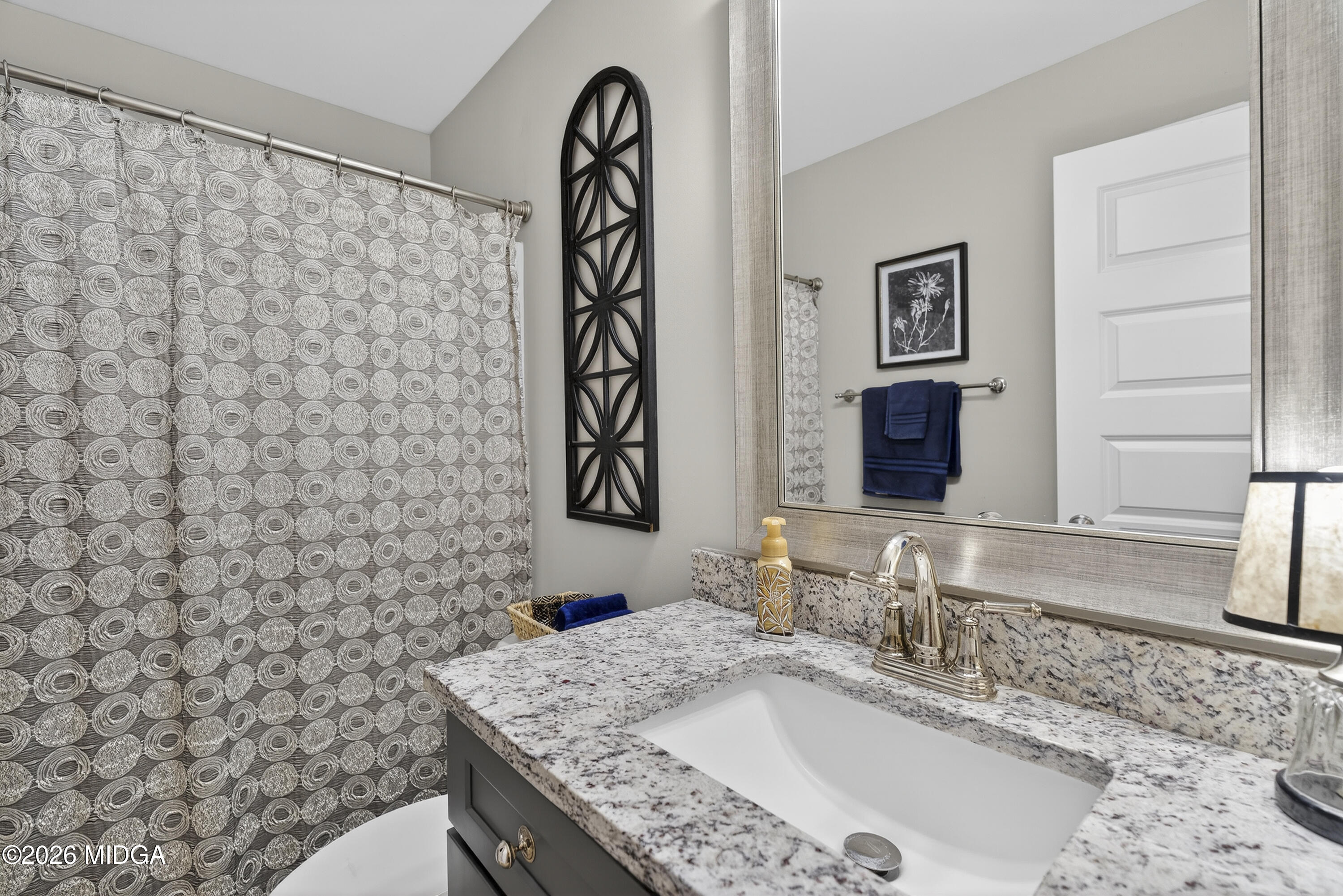 737 Springhill Drive Gray, GA 31032 - Photo 17 of 60 a bathroom with a granite countertop sink and a mirror