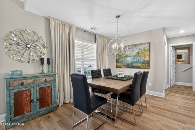 a kitchen with granite countertop a sink stainless steel appliances and cabinets