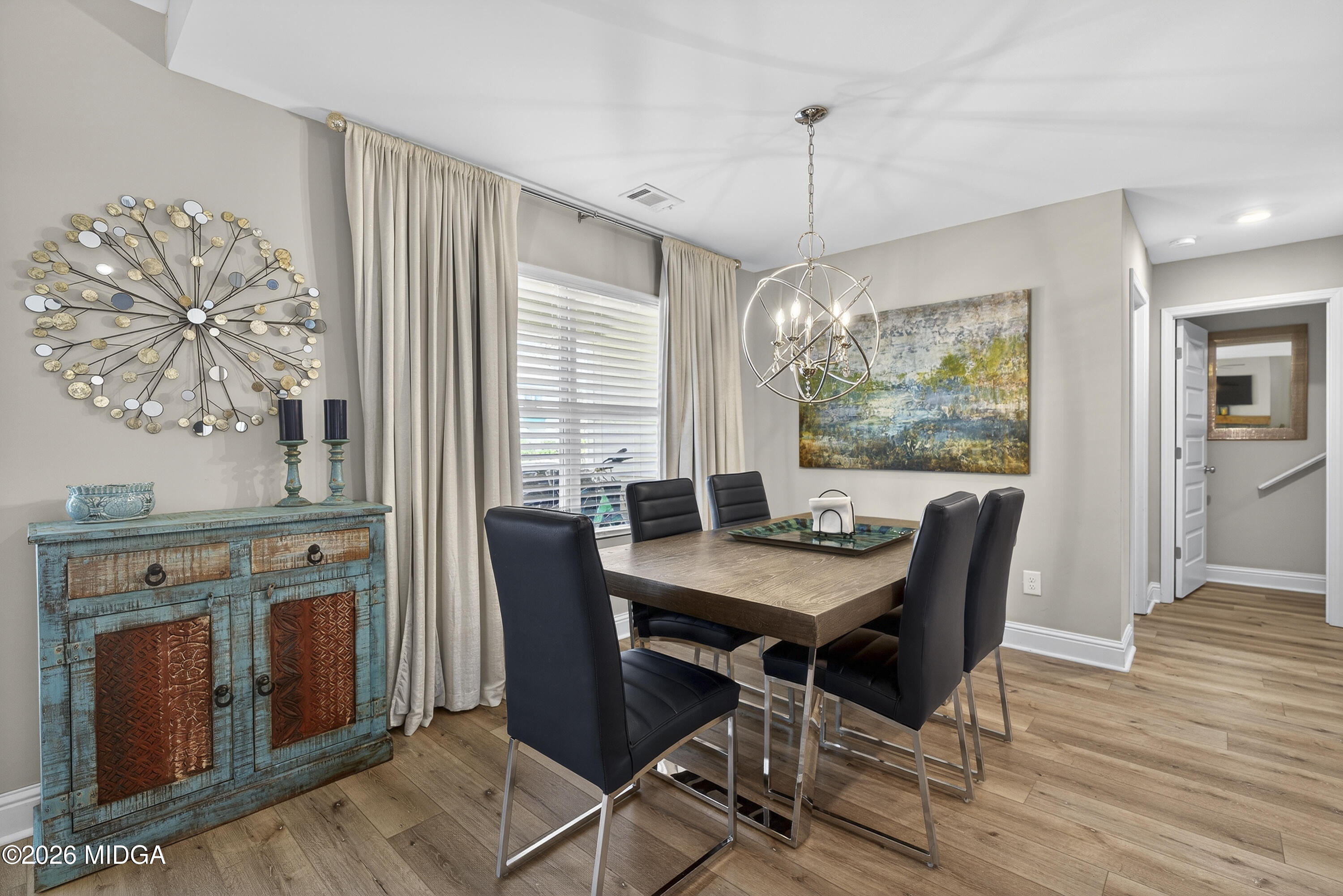 737 Springhill Drive Gray, GA 31032 - Photo 20 of 60 a view of a dining room with furniture window and wooden floor