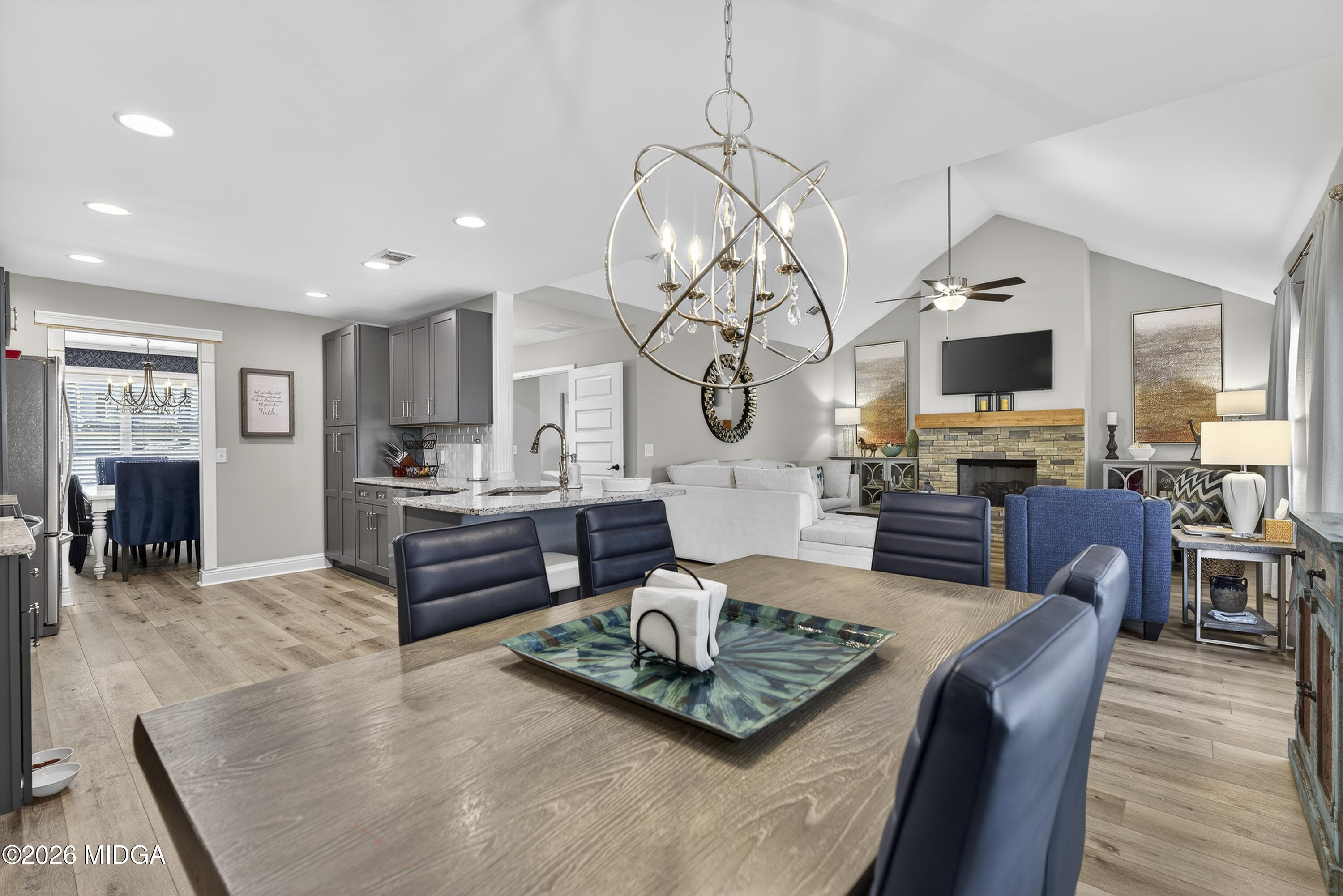 737 Springhill Drive Gray, GA 31032 - Photo 28 of 60 a living room with fireplace furniture and a chandelier