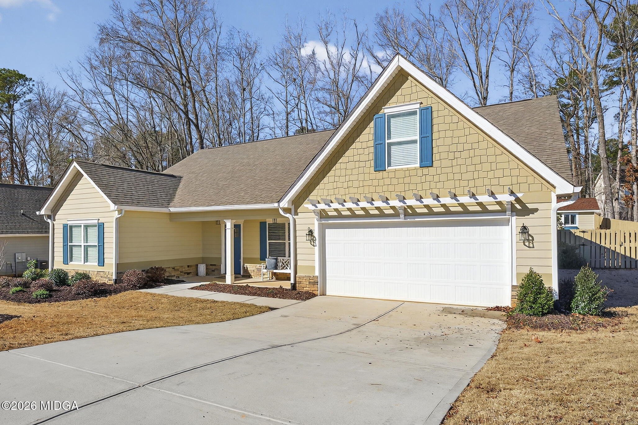 737 Springhill Drive Gray, GA 31032 - Photo 3 of 60 a front view of a house with yard and tress