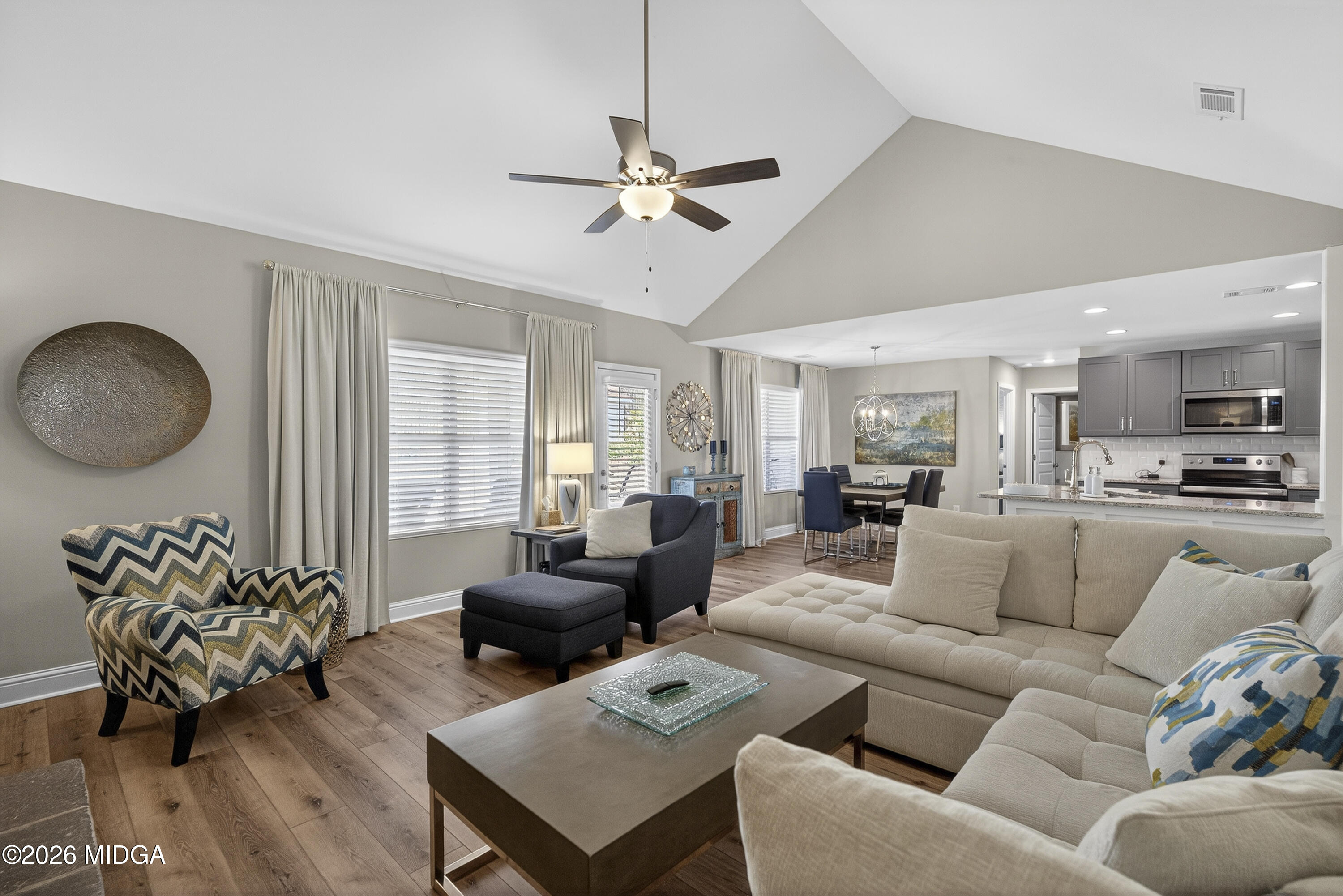 737 Springhill Drive Gray, GA 31032 - Photo 31 of 60 a living room with furniture and a large window