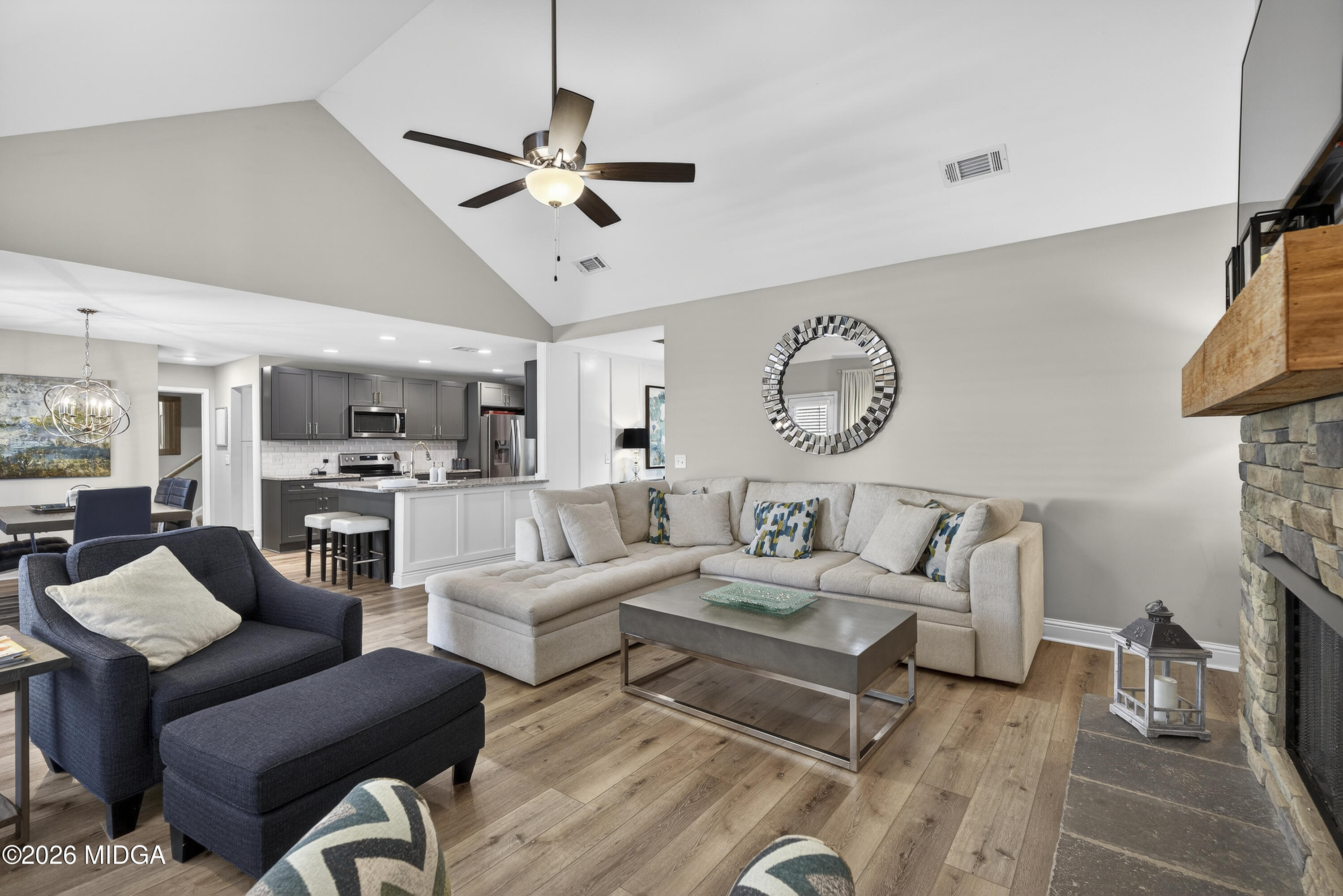 737 Springhill Drive Gray, GA 31032 - Photo 32 of 60 a living room with furniture a clock on wall and a clock