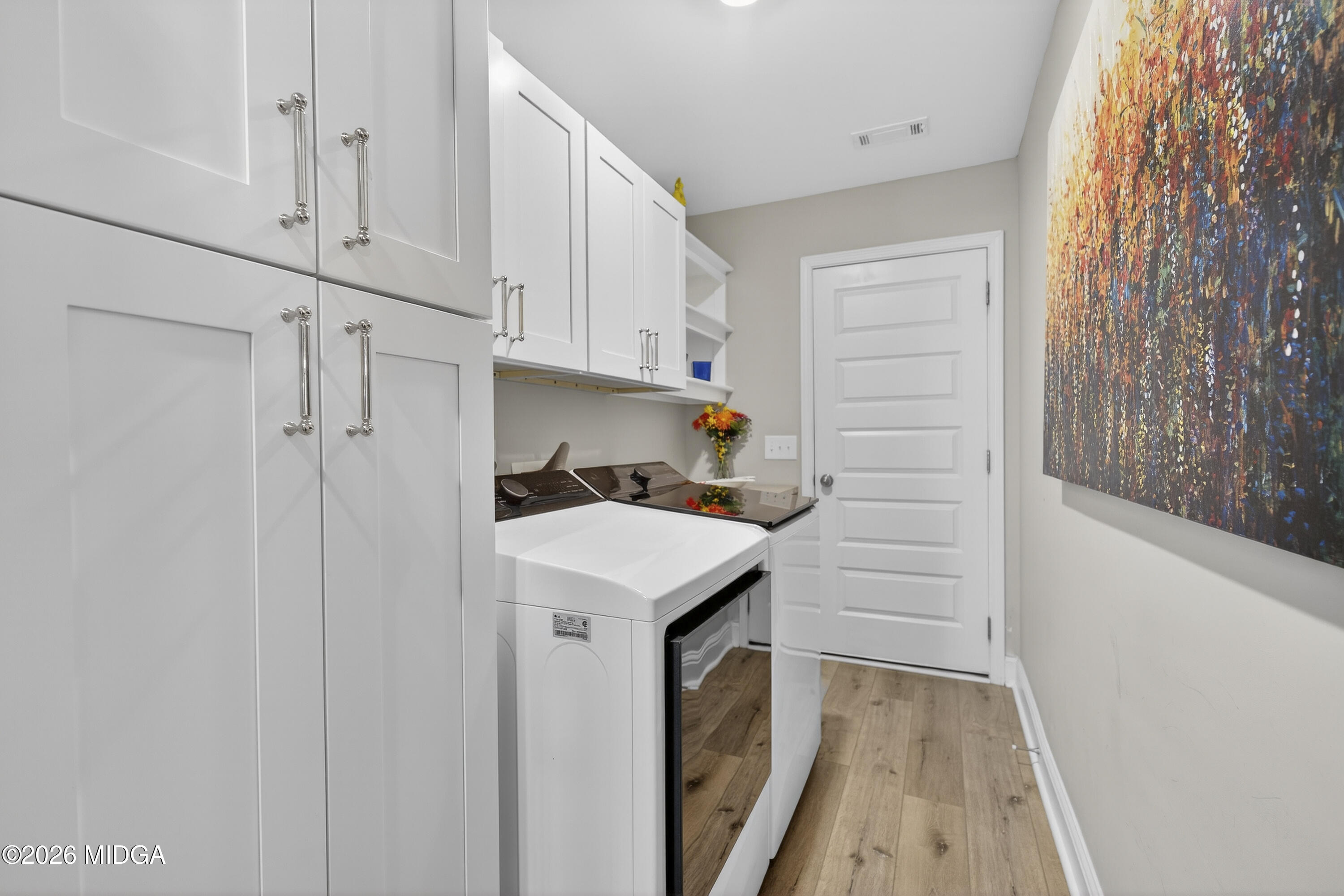 737 Springhill Drive Gray, GA 31032 - Photo 35 of 60 a utility room with cabinets washer and dryer