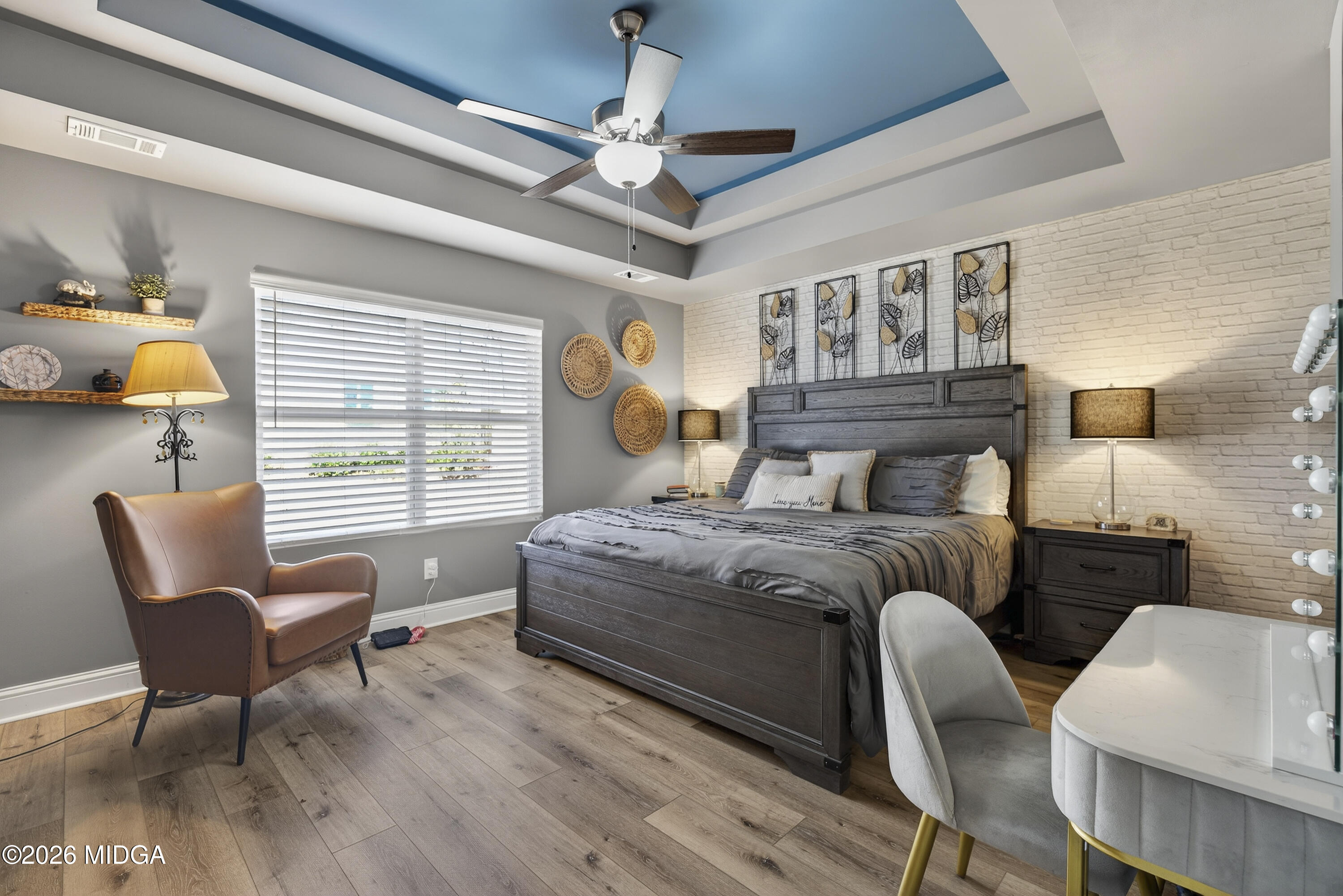 737 Springhill Drive Gray, GA 31032 - Photo 36 of 60 a bedroom with a bed a chair and a chandelier