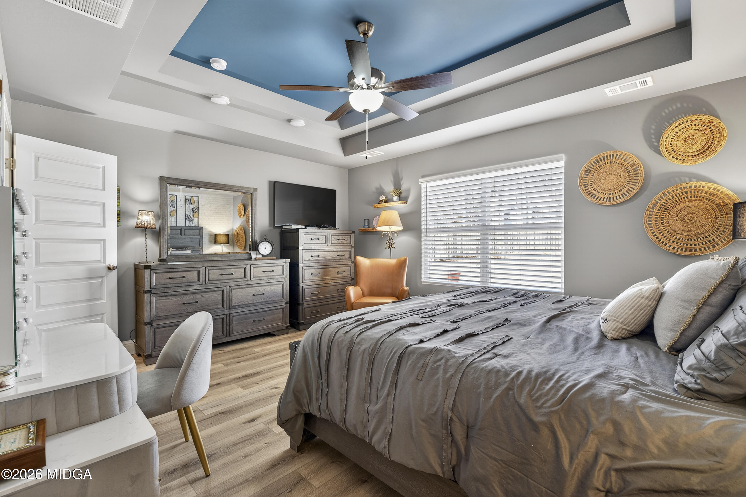 737 Springhill Drive Gray, GA 31032 - Photo 39 of 60 a bedroom with a bed next to a window and a chandelier