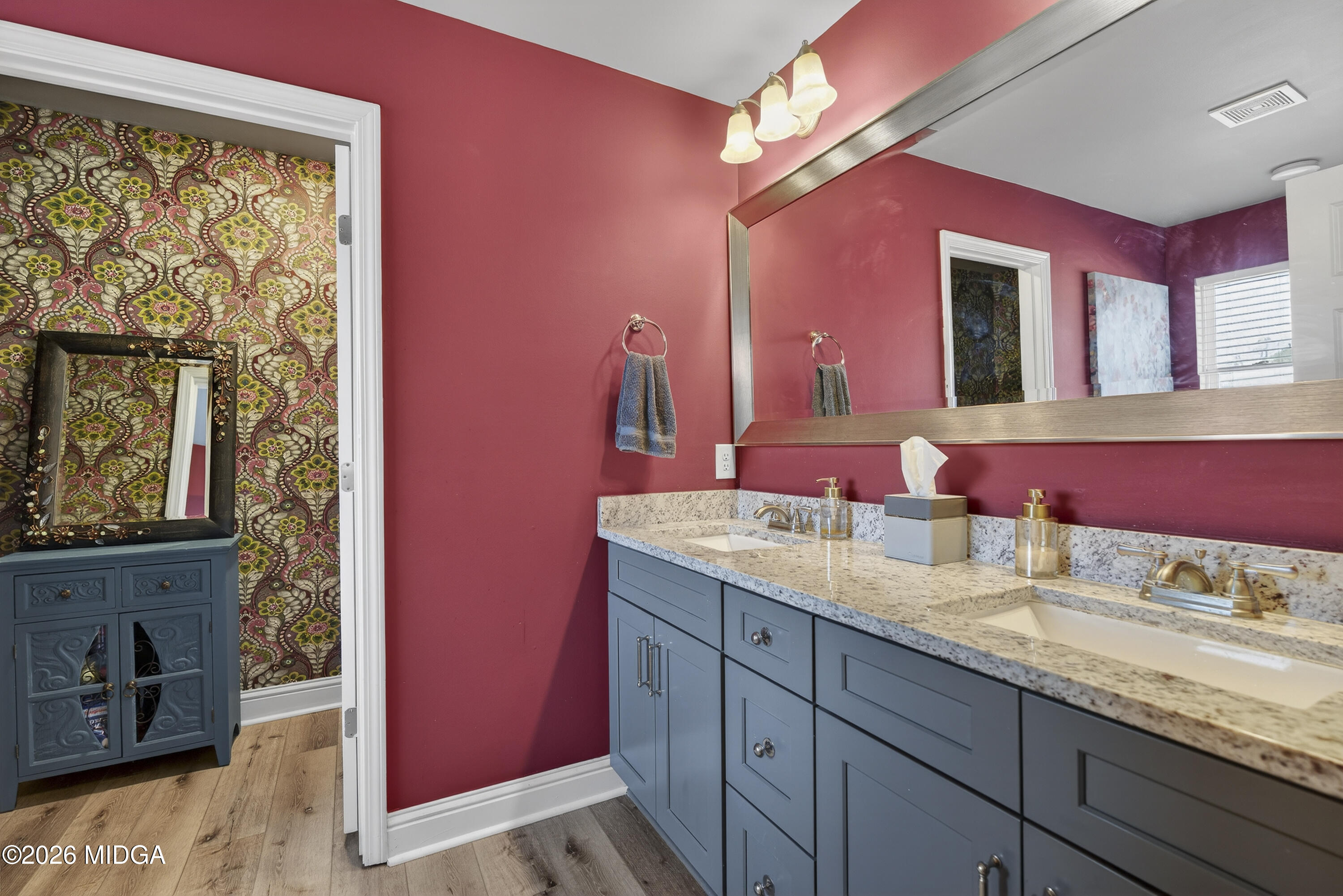 737 Springhill Drive Gray, GA 31032 - Photo 40 of 60 a bathroom with a granite countertop double vanity sink a mirror and a shower