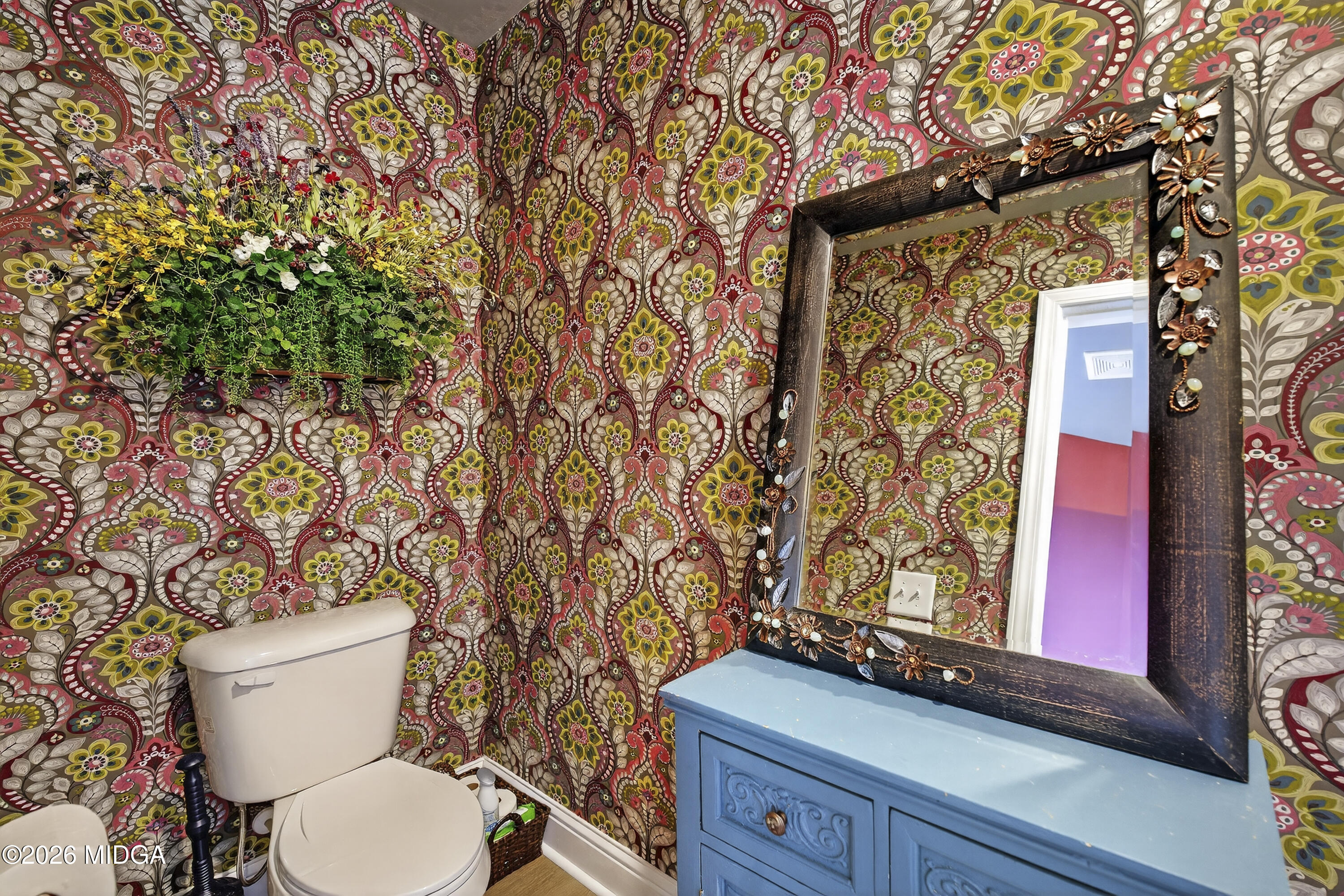 737 Springhill Drive Gray, GA 31032 - Photo 42 of 60 a white toilet sitting next to a shower curtain