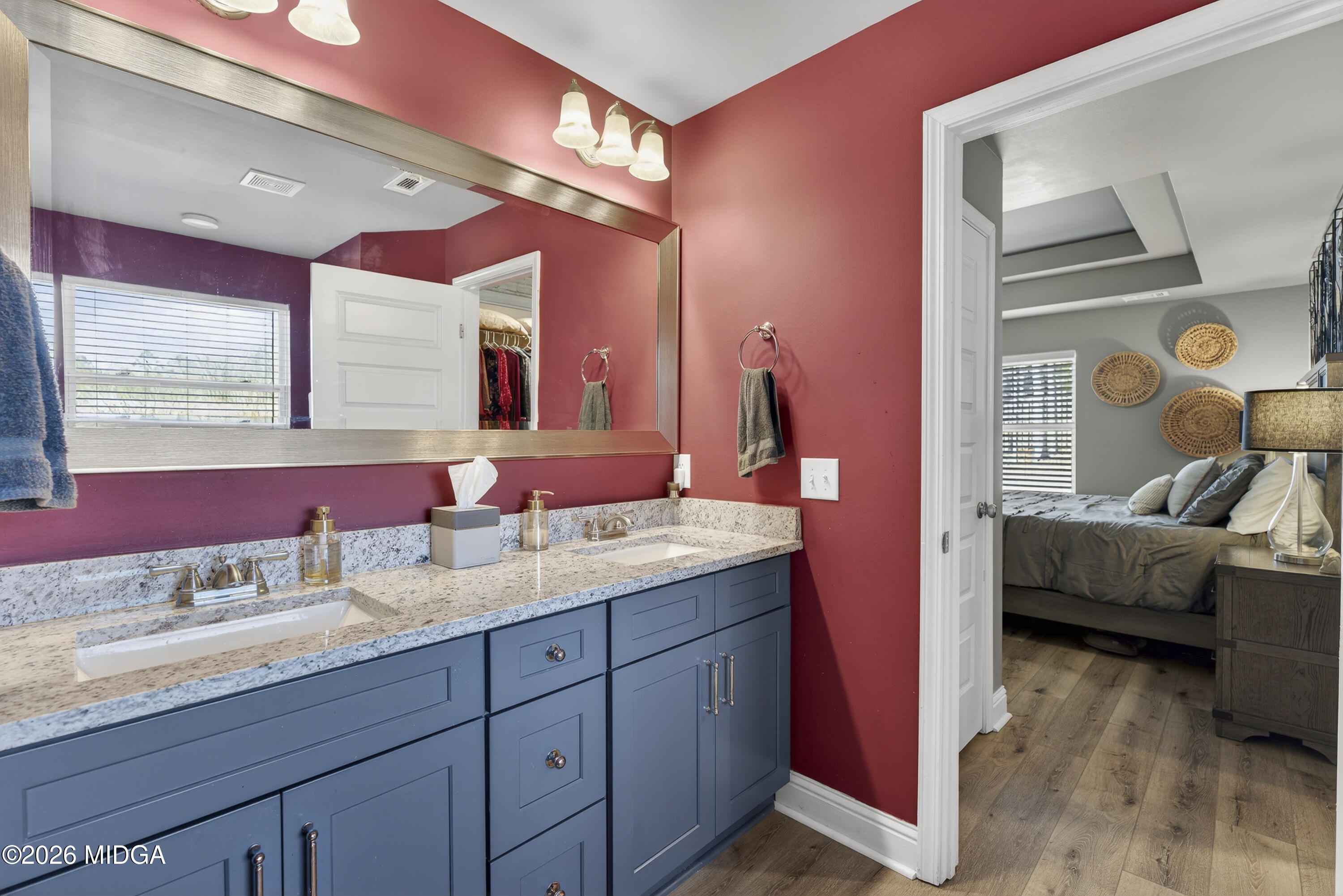 737 Springhill Drive Gray, GA 31032 - Photo 44 of 60 a en suite bathroom with a granite countertop sink and a mirror