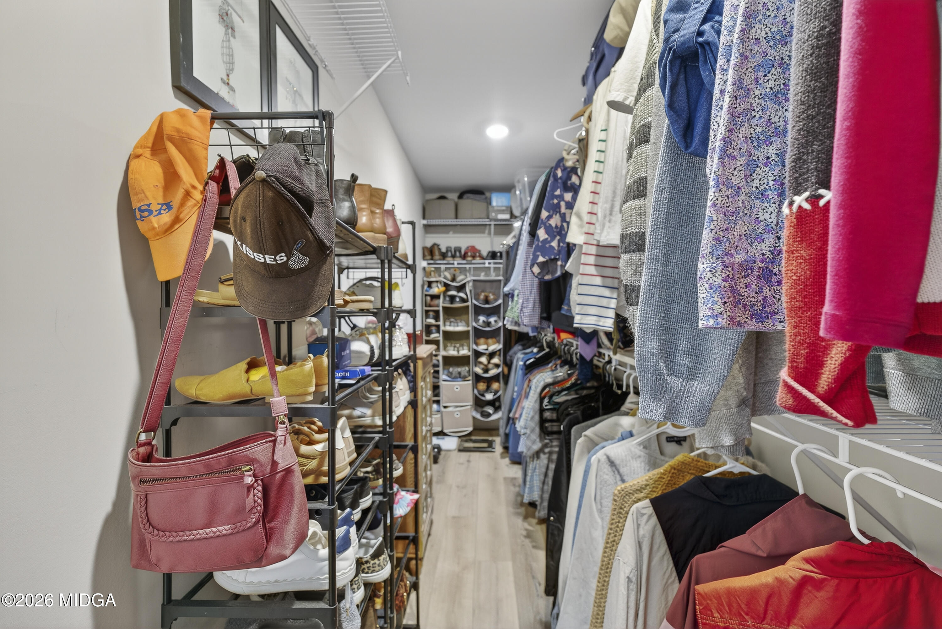 737 Springhill Drive Gray, GA 31032 - Photo 46 of 60 a view of walk in closet with clothes and shoes