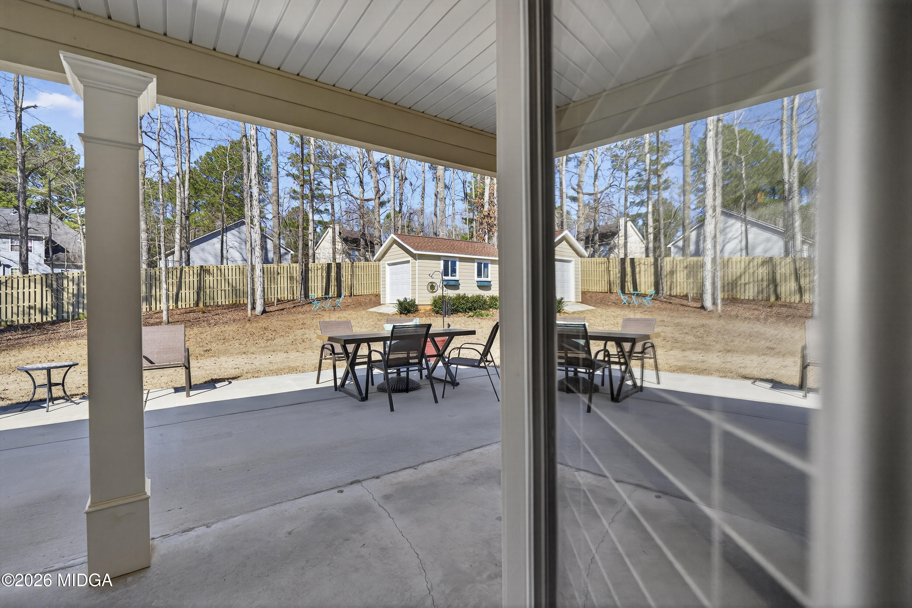737 Springhill Drive Gray, GA 31032 - Photo 52 of 60 a view of a dining room with furniture water view and a floor to ceiling window