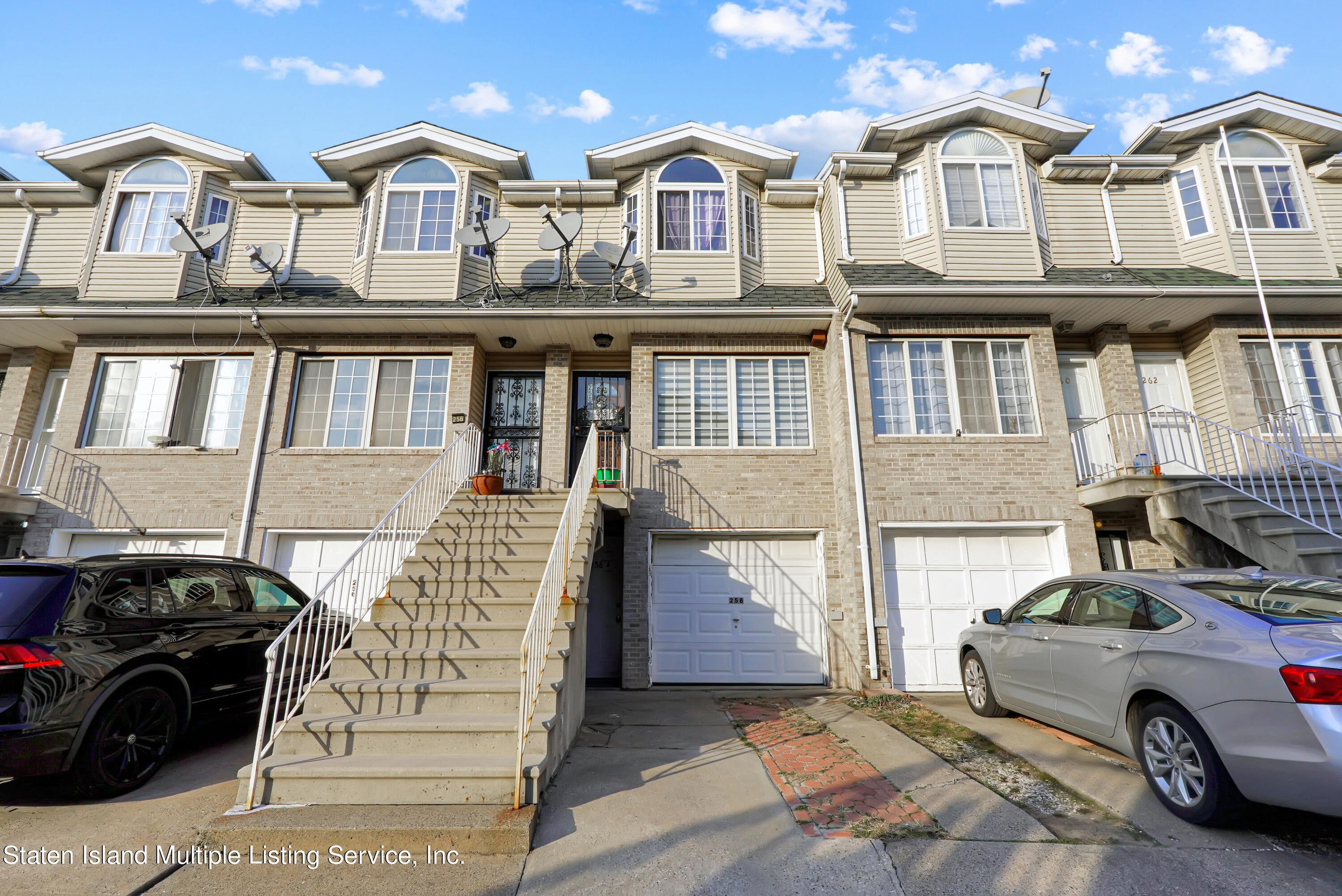 258 Edgewater Street Staten Island, NY 10305 - Photo 1 of 33 a car parked in front of a white building