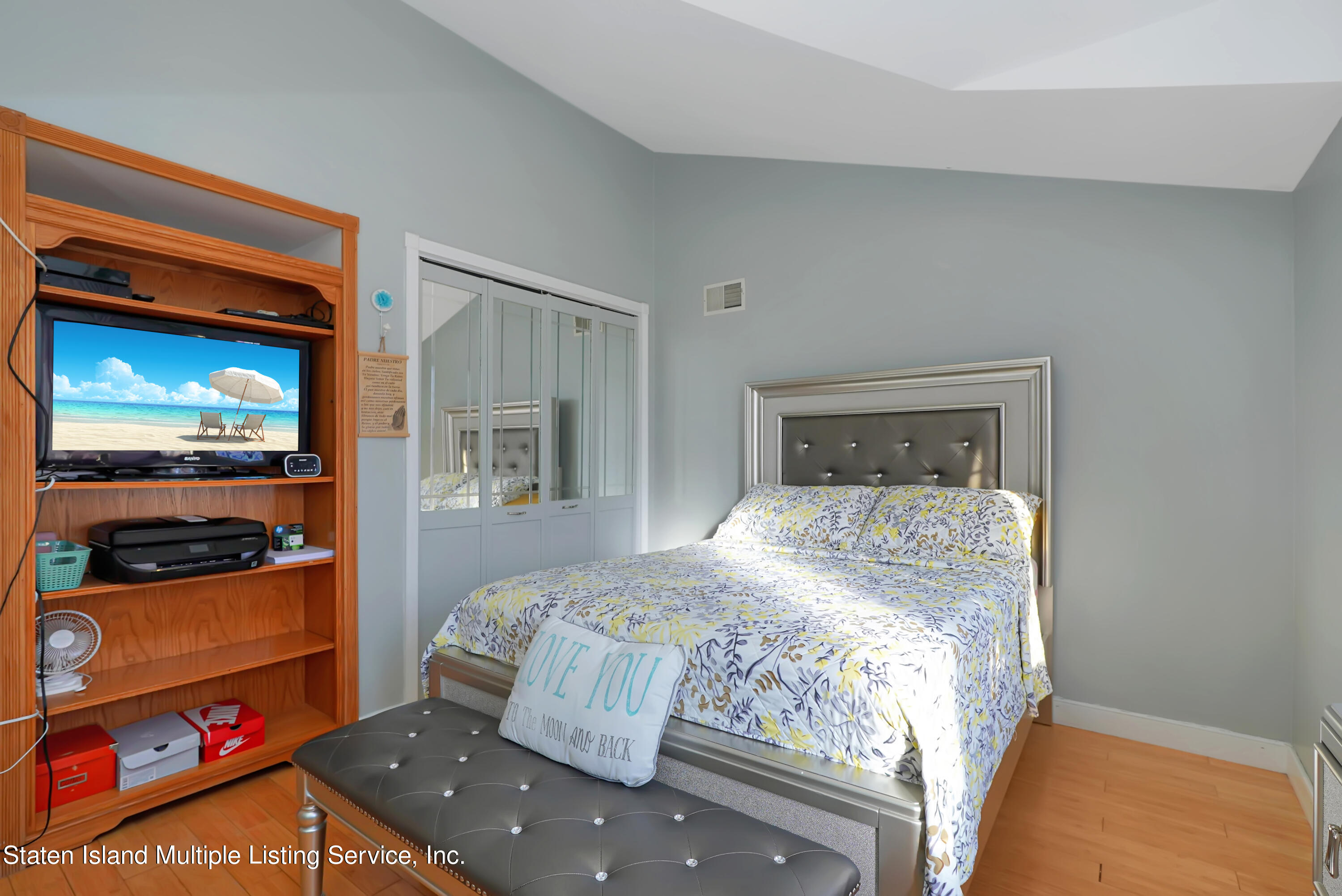 258 Edgewater Street Staten Island, NY 10305 - Photo 18 of 33 a bedroom with a bed and a television